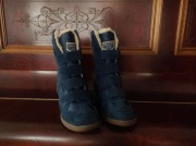 Wysokie sportowe zimowe buty damskie skechers z futerkiem