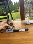 TESLA  Napinacz dociąg pasa bezpieczeństwa 