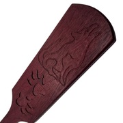 Packa BDSM wykonana z drewna amarantowego. Motyw wilka i wilczych łap.