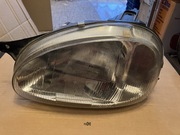 Lampa Reflektor Opel Corsa B lewy nowy TYC 
