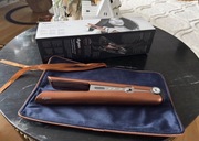 Prostownica-lokówka Dyson Corrale w kolorze miedzi i niklu.