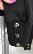 Megi czarne spodnie ozdobne guziki