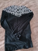 Sweter z srebrnymi ozdobami 