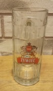 Szklany kufel do piwa marki Żywiec.