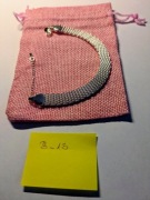 Bransoletka pleciona, posrebrzana w gustownym woreczku. B_13