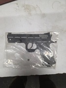 wieszak w kształcie pistoletu