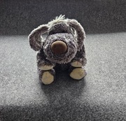 Piesek maskotka z sympatycznym spojrzeniem