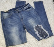 Spodnie jeansowe jeans dziury ćwieki 