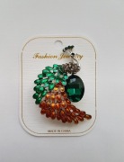 Broszka paw zielony pomarańczowy kolorowy cyrkonie 