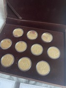 Srebrne (pozłacane) monety z zamkami i miastami