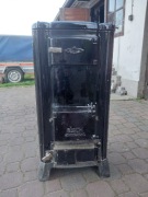 Żeliwny kominek stary styl antyczny z Niemiec