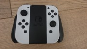 Zestaw 2 oryginalnych białych kontrolerów Joy-Con Nintendo Switch + grip