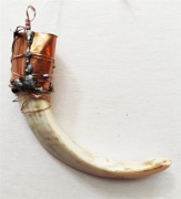 Amulet słowiański z szabli dzika.