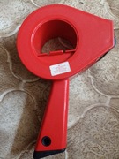 Maszynka do klejenia taśmy samoklejącej.