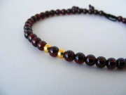 Bransoletka męska wikinga 24 karatowe złoto kamień granat Norwegia