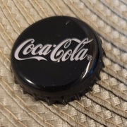 Kapsel Coca-Cola butelkowane