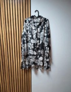 Zwiewna bluzka we wzory z wiązaniem