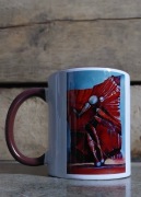 Kubek ze zdjęciem autorskiego obrazu.