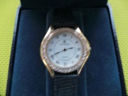 złoty zegarek damski cyma 18k z brylantami.