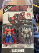 Transformers McFarlane Page Punchers Optimus Prime Megatron NOWE Komiks X2