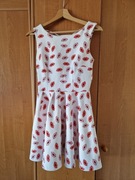 Romantyczna sukienka bez rękawów rozkloszowana mini kokarda