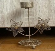 Metalowy świecznik na tealight z motywem gwiazd