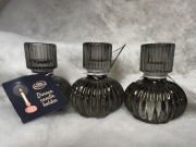 Trzy świeczniki na świece stołowe szare