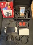 Nintendo Switch OLED +karta pamięci +etui +walizka +gra +ładowarka