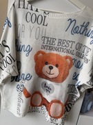 Luźna biała bluzka z pomarańczowym misiem oversize