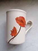 Kubek,garnuszek ceramiczny z uchem i jednym makiem.