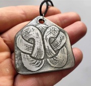 Trawiony amulet słowiański