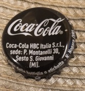 Kapsel Coca Cola butelkowane