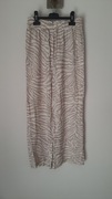 spodnie materiałowe letnie lato zwiewne beżowe zebra Terranova XS/34