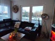 Czarna sofa skórzana w kształcie litery L z funkcją spania 