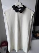 Elegancka biała sukienka Mohito z czarnym kołnierzykiem rozmiar S