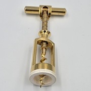 Korkociąg mosiężny cylinder połysk mechaniczny biała podstawa