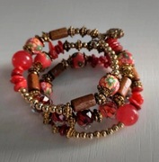 Bransoletka zwijana na lince z dodatkiem kamieni i koralami czerwona