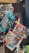 Nintendo Switch Lite + 5 gier