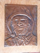 Portret rybaka na mosiężnej płycie 