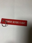 Haft "remove before flight" w kolorze czerwonym