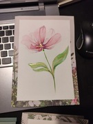 Kartka ręcznie malowana farbami akwarelowymi.