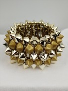 Bransoletka damska elastyczna złota z kolcami 