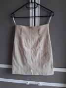 Beżowa elegancka spódnica z wzorkami z haftem na zamek do kolan XS litera A