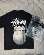 Biała koszulka stussy z aniołem