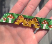 Bransoletka z koralików toho z kotem i muchomorami