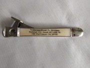 Stara przycinarka do cygar z reklamą.