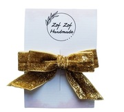 Błyszcząca kokarda na spince