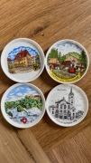 Zestaw 4 porcelanowych talerzyków dekoracyjnych z widokami miast