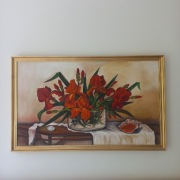 Obraz olejny w złotych ramach.