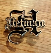 Żelazny znaczek przykręcany z logo zespołu Hetman 